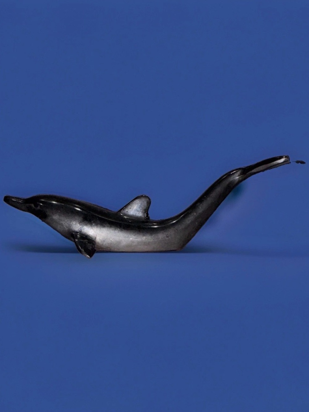 Sleek silver-plated Dolphin bottle opener